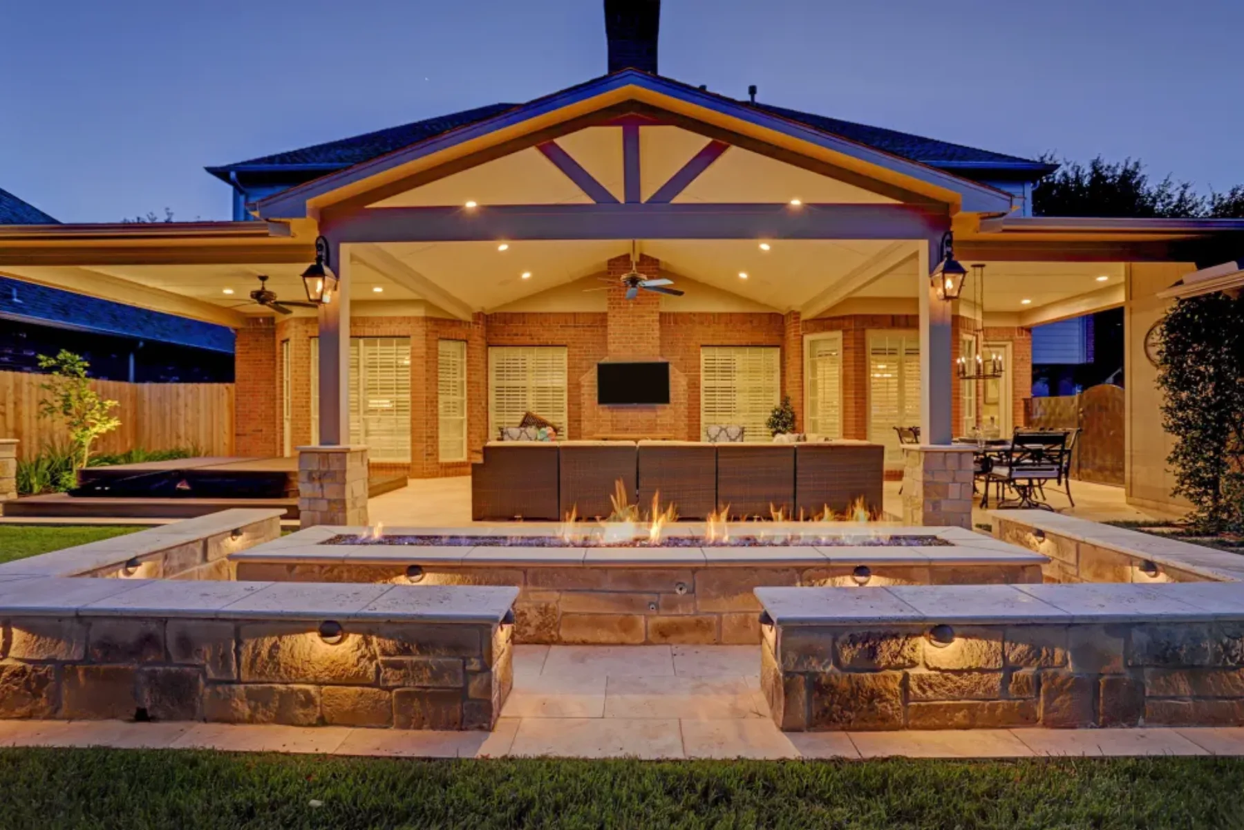 Custom pavilion and pool house beside an outdoor living space
